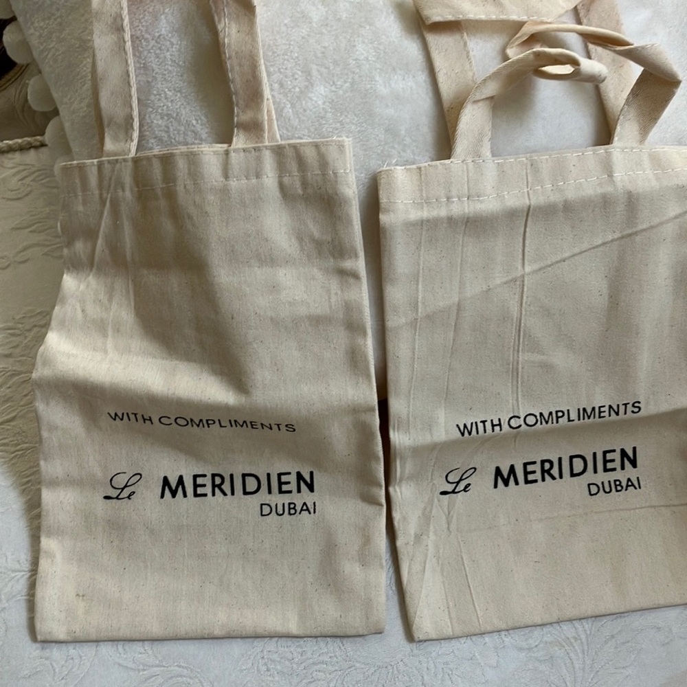 Two small cloth shopping totes from fancy hotel chain. Great for wine bottles🍷